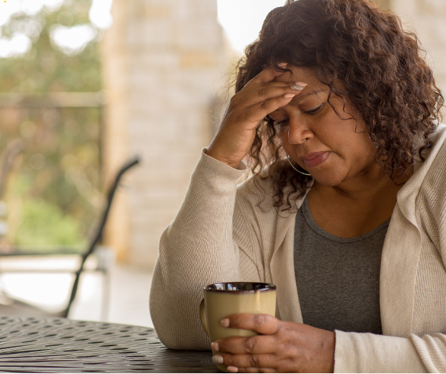Woman drinks coffee while wondering what hydroxyzine is